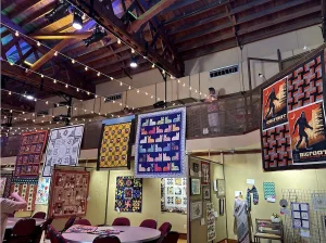 Quilts on display in a large hall